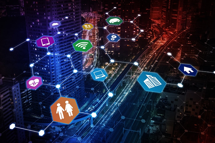 hexagons with application icons, connected by glowing lines overlaid over a city
